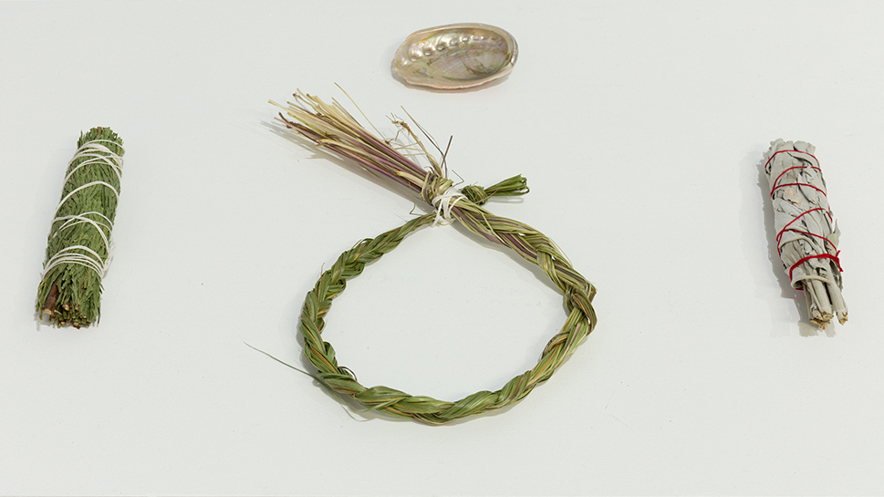 Meryl McMaster, objects from “Aski Earth Terre Yarta,” Australian Centre for Photography, Sydney, 2019. Clockwise: cedar (<em>Thuja occidentalis</em>), abalone shell (<em>Haliotis</em>), white sage (<em>Salvia apiana</em>), sweetgrass (<em>Hierochloe odorata</em>). Photo: Michael Waite.