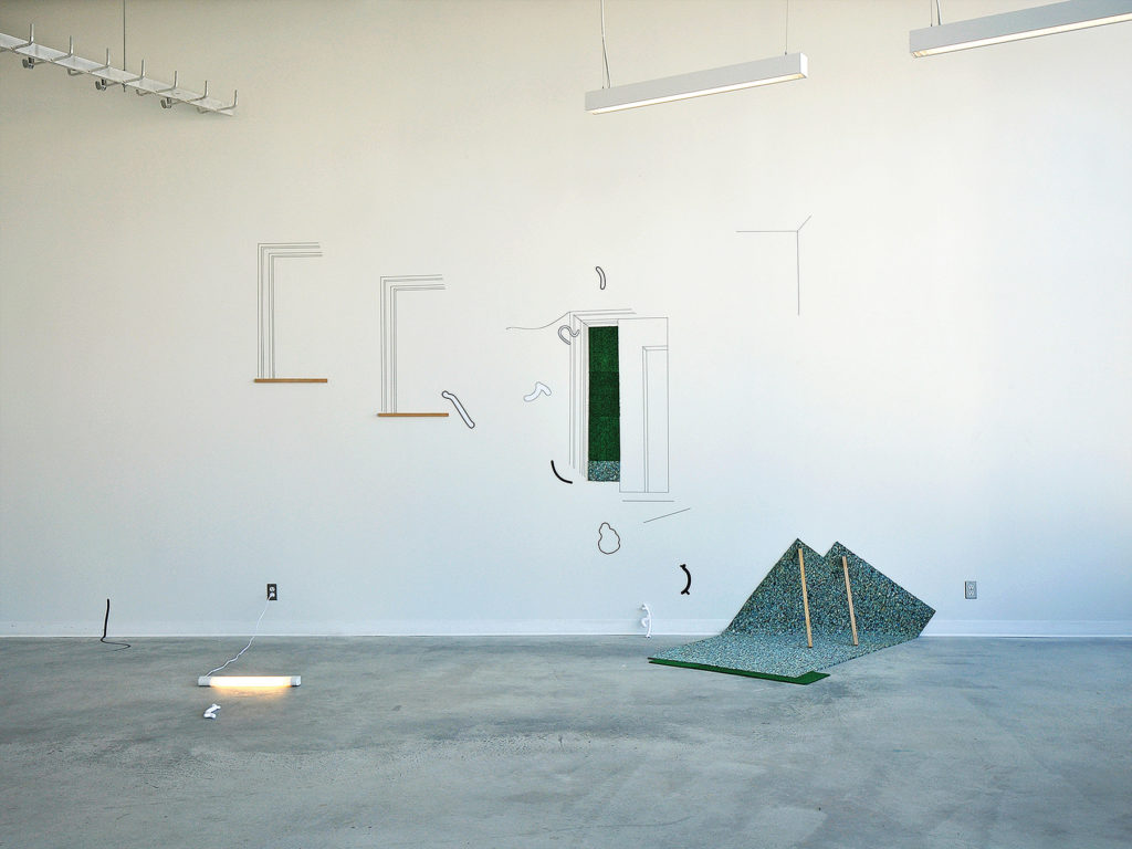 Katrina Marie Mendoza, <em>Kawawa Window & Door</em>, 2014. Vinyl, 3D prints, artificial turf,
carpet underlay, wood and light, dimensions variable. Courtesy the artist.