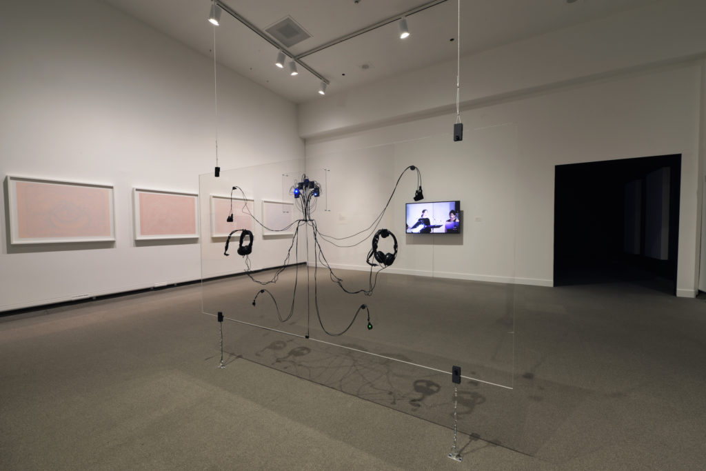 Foreground: Erin Gee, <em>Pinch and Soothe</em>, 2019. 3-D printed sensors, laser-cut acrylic, custom circuitry. Installation view from ”Erin Gee: To the Sooe” at the MacKenzie Art Gallery. Photo: Don Hall.