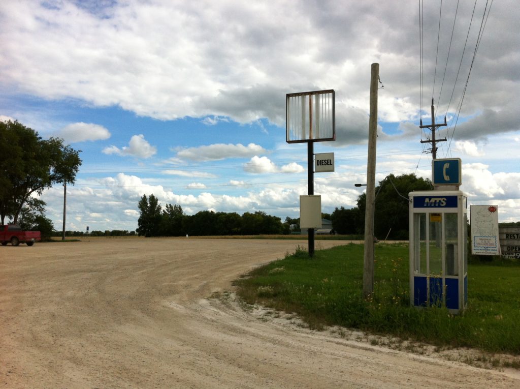 Jeanne Randolph, <em>Here it is from another view. I wanted to document this sort of view as often as I could—the forsaken telephone booth among its injured friends. As you can see, in a way, it’s in its own forlorn community.</em> 2018. Archival inkjet print, 21.5 x 27.9 cm. Courtesy the artist and Paul Petro Contemporary Art.