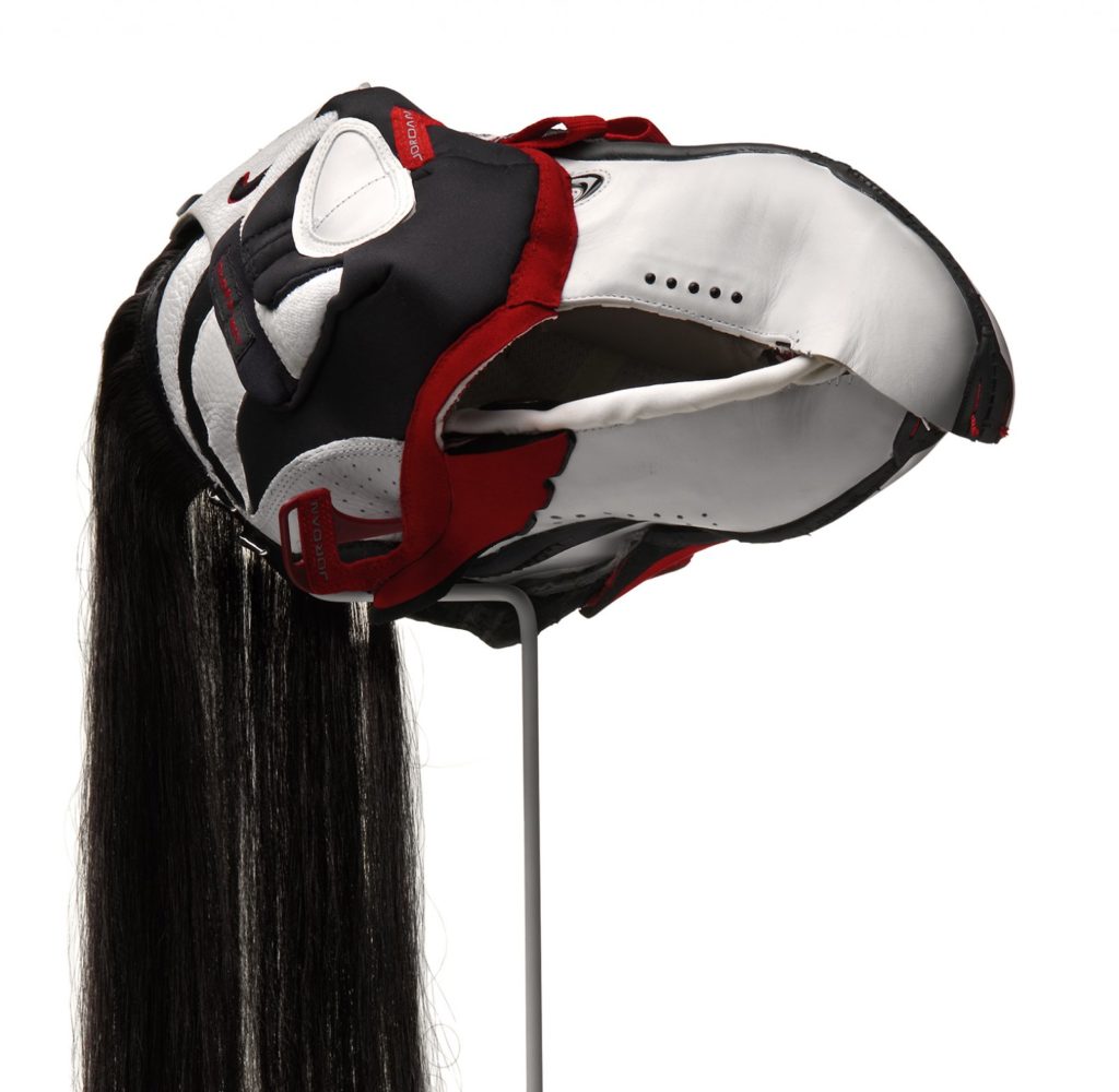 Brian Jungen, <em>Prototype for New Understanding #23</em>, 2005. Nike air jordans, human hair, 47 x 52 x 15 cm. Photo: Trevor Mills, Vancouver Art Gallery. Courtesy Catriona Jeffries, Vancouver