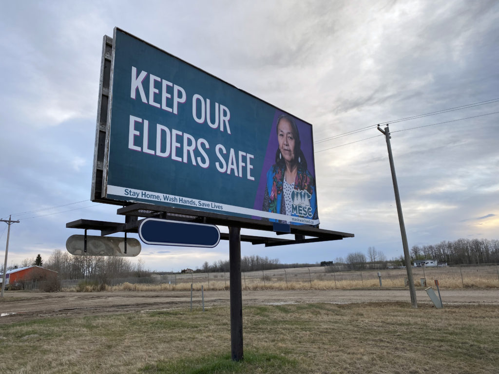 MESC “Keep Our Elders Safe” campaign, with portrait of Sadie Buffalo by Conor McNally, 2020. Photo Tom Crier.