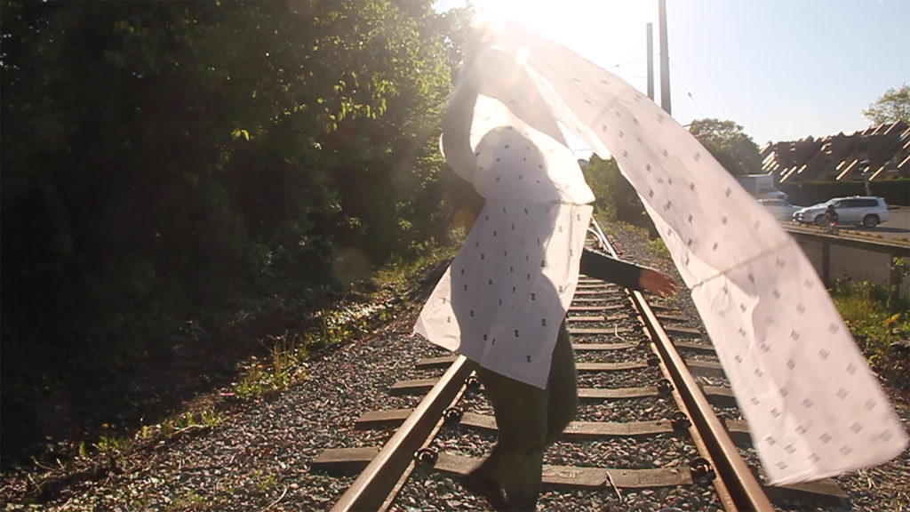 Artist Faune Ybarra creating the video work <em>Thinking of you, railroad near 6th Ave.</em> (2020) in Vancouver as part of her remote spring residency with Eastern Edge Gallery. Photo: Courtesy the artist.