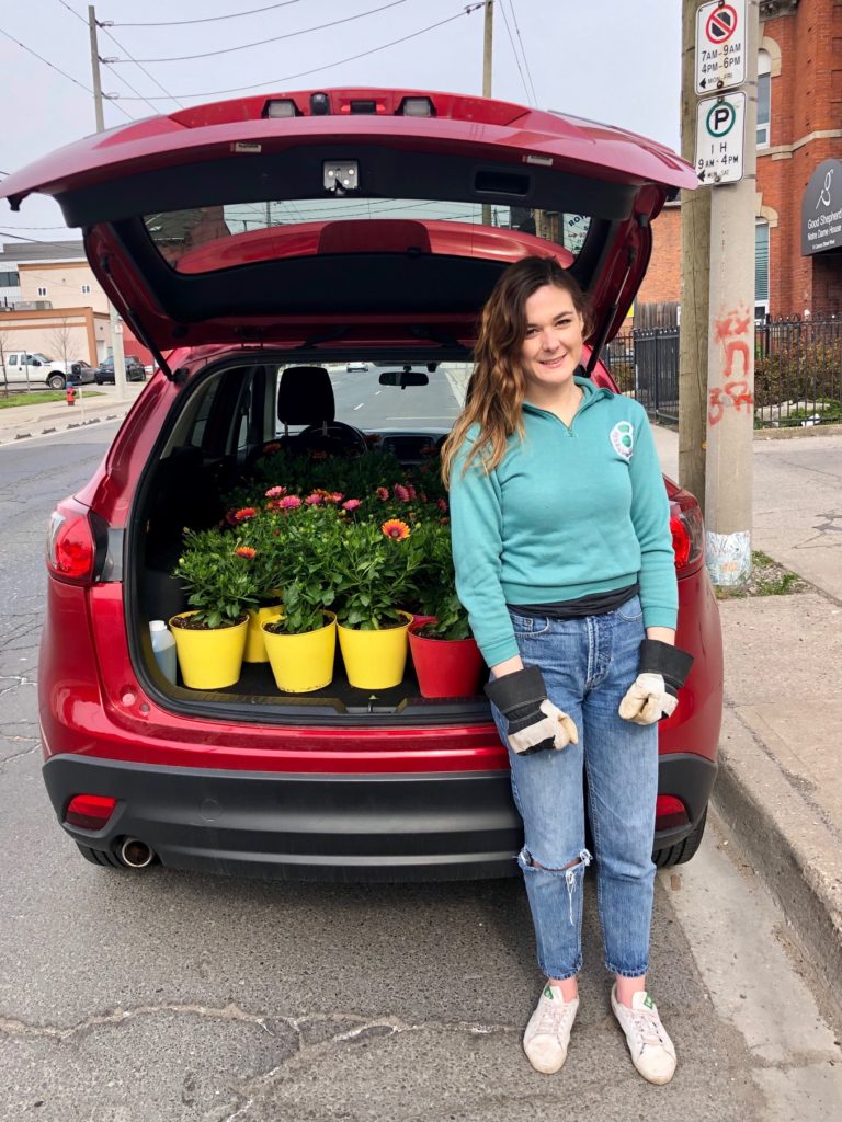Julie Dring, executive director of Hamilton Artists Inc., out on flower delivery for the fundraiser.