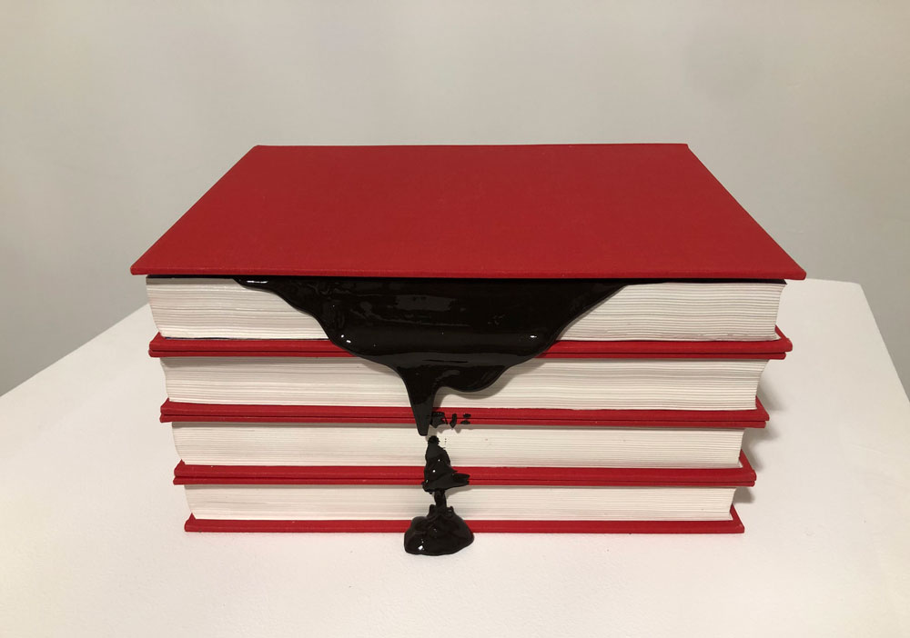 Chantal Gibson, <em>Redacted Text</em>, 2019. Altered Book, Canadian Encyclopedia (3 Vol), liquid rubber. Photo: Chantal Gibson. Courtesy the artist.

 

“An encyclopedia must undergo revision if it is to remain current and if it is to hold its place as a reference point amid the rapid proliferation of knowledge.” From the preface to <em>The Canadian Encyclopedia</em>, 2nd edition. Hurtig Publishers Ltd. Edmonton, Alberta, 1988.