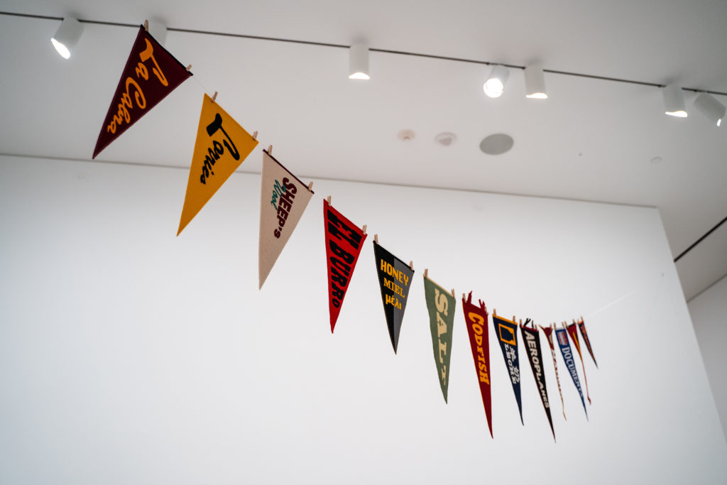Bill Burns, <em>The String of Boiled Wool Pennants about Trade, Love and Precarity</em>, 2020. Boiled wool pennants, 40 x 10 x 0.4 cm each. Courtesy of the artist and MKG127.