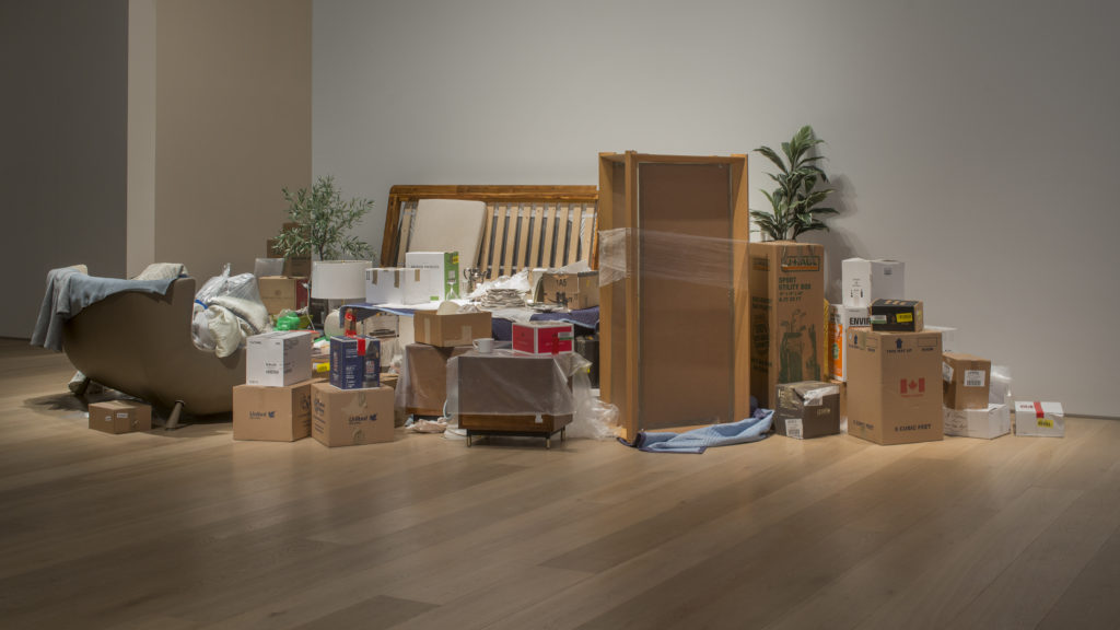 Liz Magor, <em>One Bedroom Apartment</em>, 1996–. Contents of a one-bedroom apartment, found and sourced furniture, boxes, packing materials and books, dimensions variable.