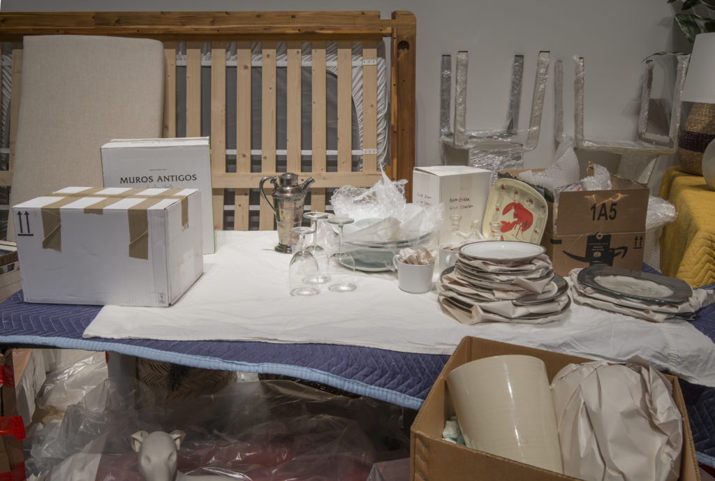 Liz Magor, <em>One Bedroom Apartment</em>, 1996–. Contents of a one-bedroom apartment, found and sourced furniture, boxes, packing materials and books, dimensions variable.