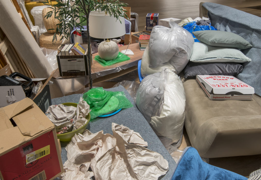 Liz Magor, <em>One Bedroom Apartment</em>, 1996–. Contents of a one-bedroom apartment, found and sourced furniture, boxes, packing materials and books, dimensions variable.