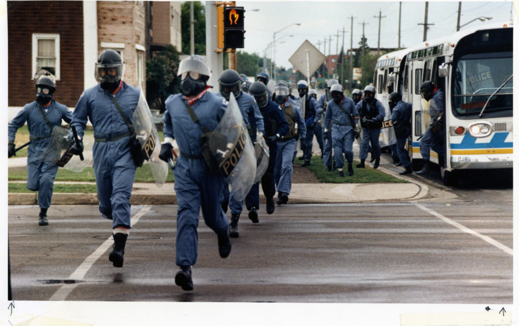 Edmonton Police at the Gainers plant, 1986. Material republished with the express permission of Edmonton Journal, A Division of Postmedia Network Inc.