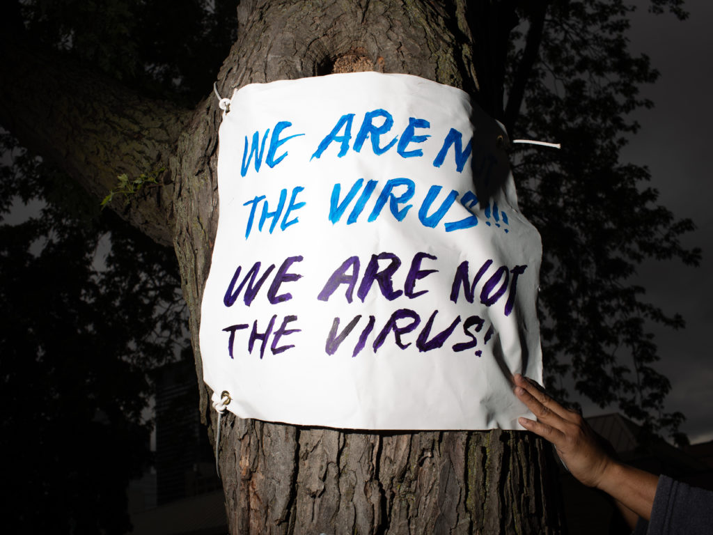 Jeff Bierk, <em>We Are Not The Virus, From Tave and Parkdale, at Moss Park with John Bush, Simone Schmidt and Ginger Dean, May 31, 2020</em>, 2020. Photograph.