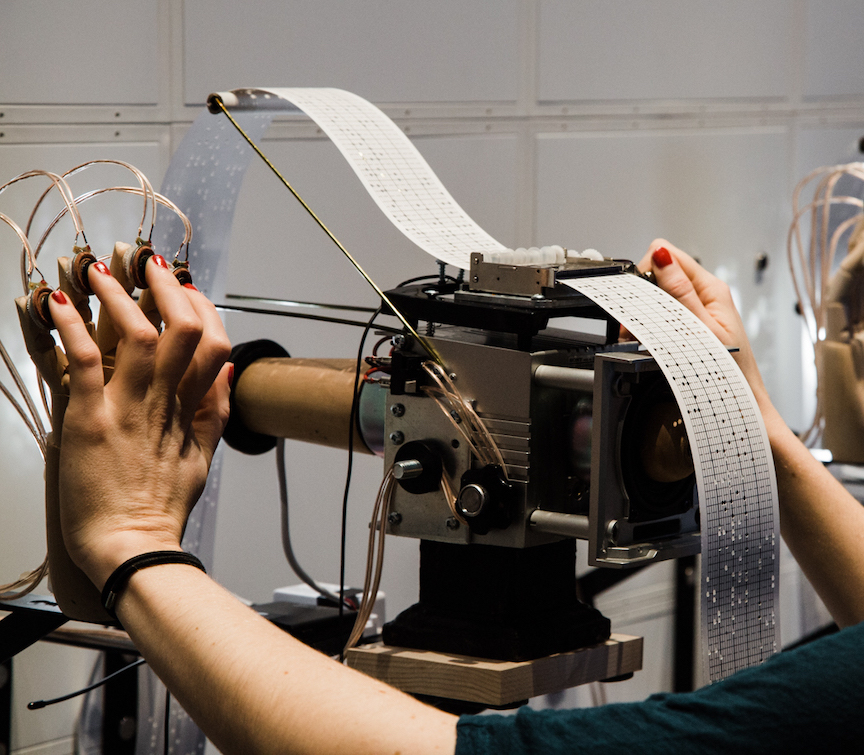 David Bobier, <em>Transcommunicator I & II</em> (detail), 2019–20. Found objects, programmable music boxes, paper scrolls, LED lights, tripods, wireless audio system, tactile transducers, wood and steel brackets, dimensions variable. Photo: Julia Salles.